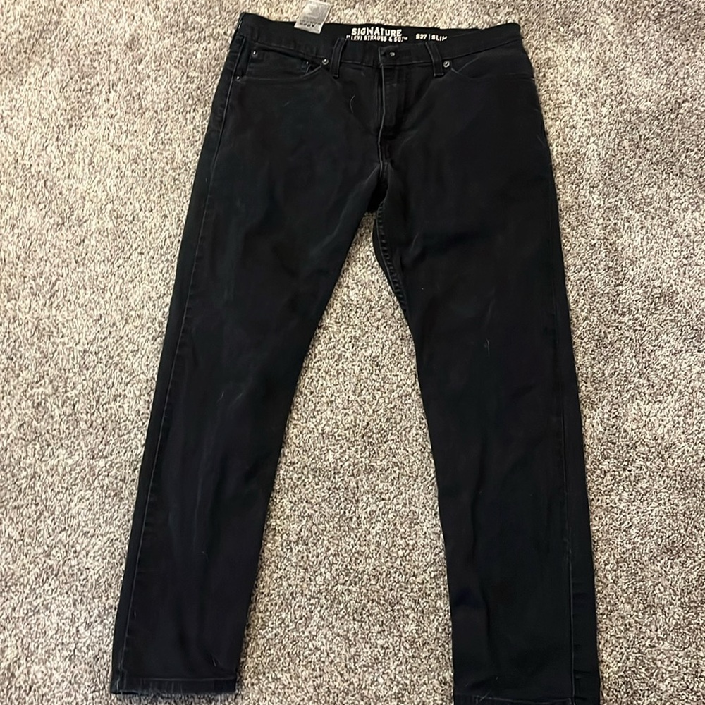 These are some men’s jeans. They are black and are Levi’s.